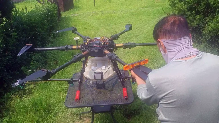 a man with a mask on his face working on a drone